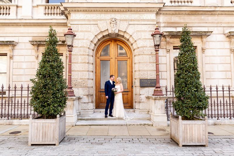 Newly married couple outside Burlington House front door