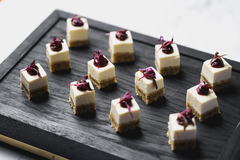 small desserts arranged on a board